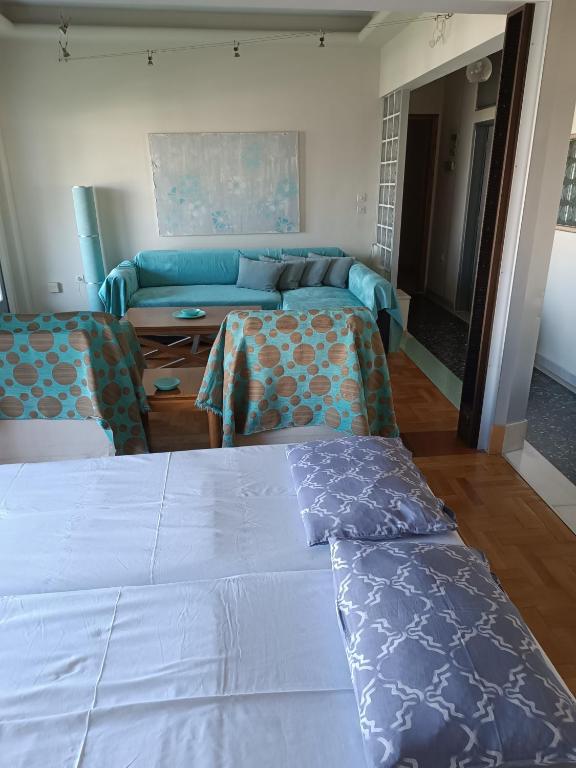 A bed or beds in a room at Lilioum Apartment
