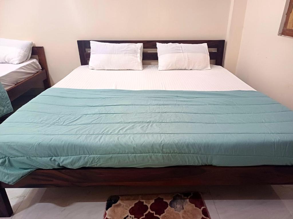 Postel nebo postele na pokoji v ubytování Vaidehi Vihar Kunj, Home Stay