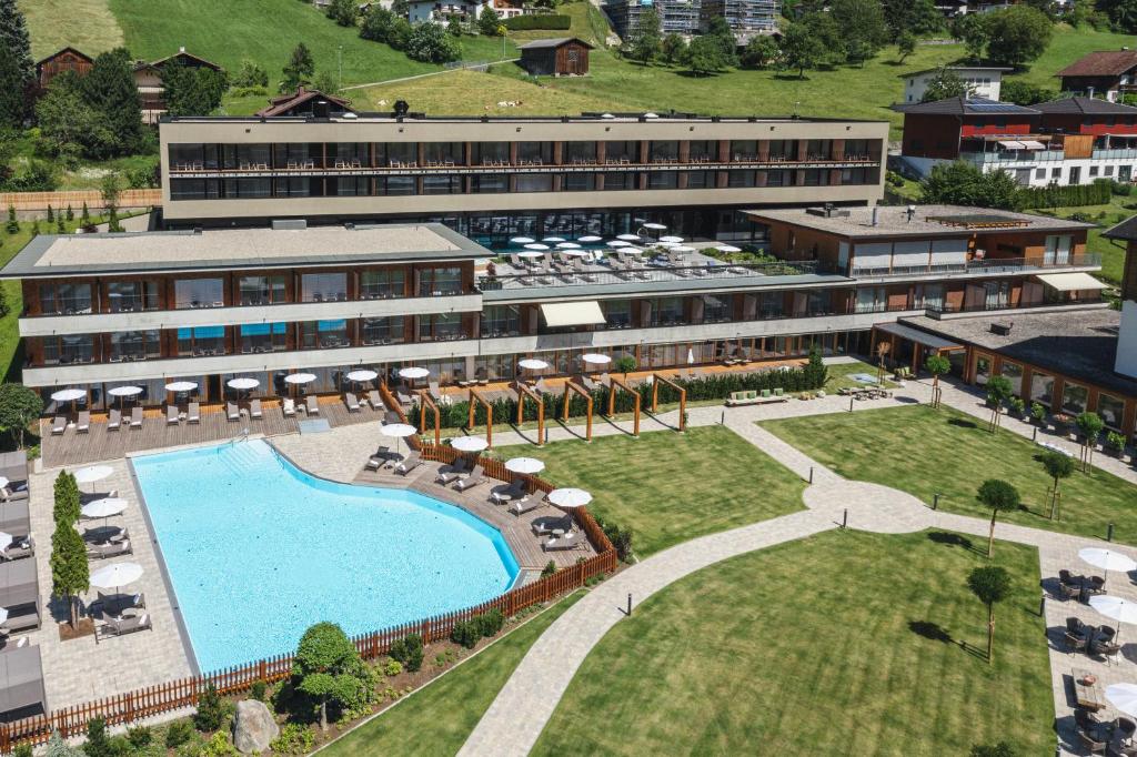 an aerial view of a hotel with a swimming pool at Alpenhotel Montafon & SPA in Schruns