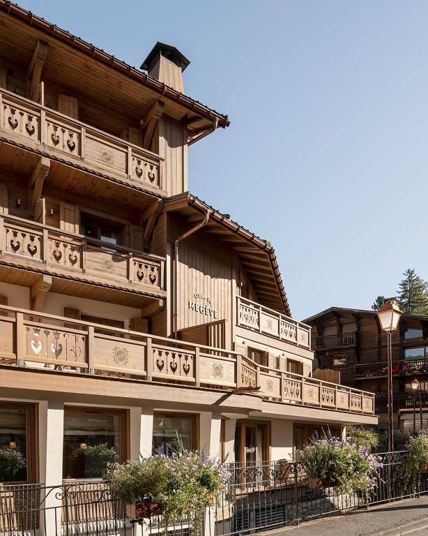 a building with balconies on the side of it at Coeur de Megève in Megève