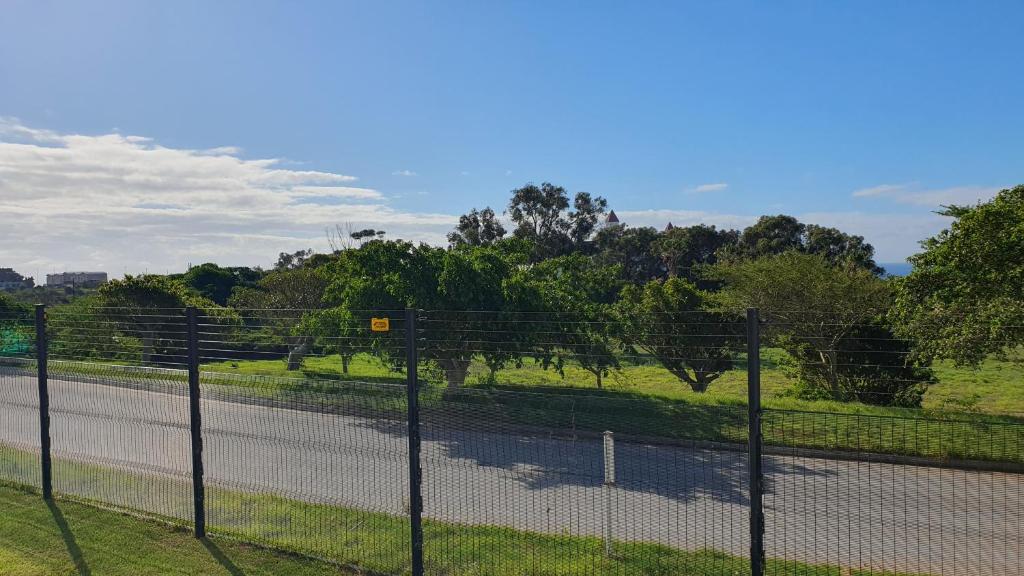 a fence on the side of a road at The Paramount and The Supreme at Bellamare in Summerstrand