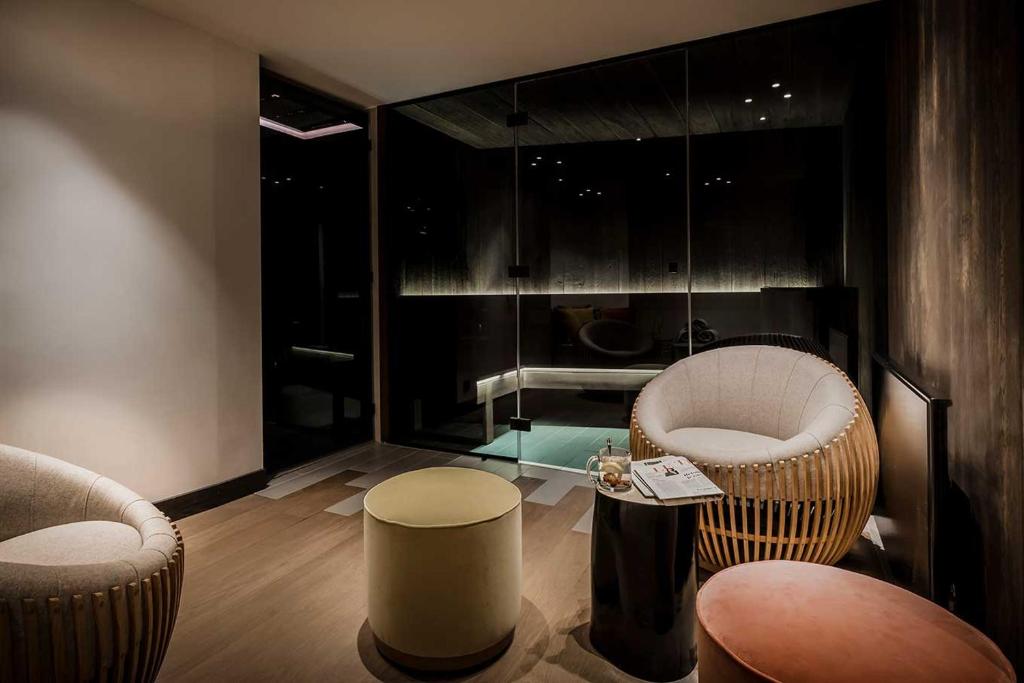 a living room with two chairs and a table at Coeur de Megève in Megève