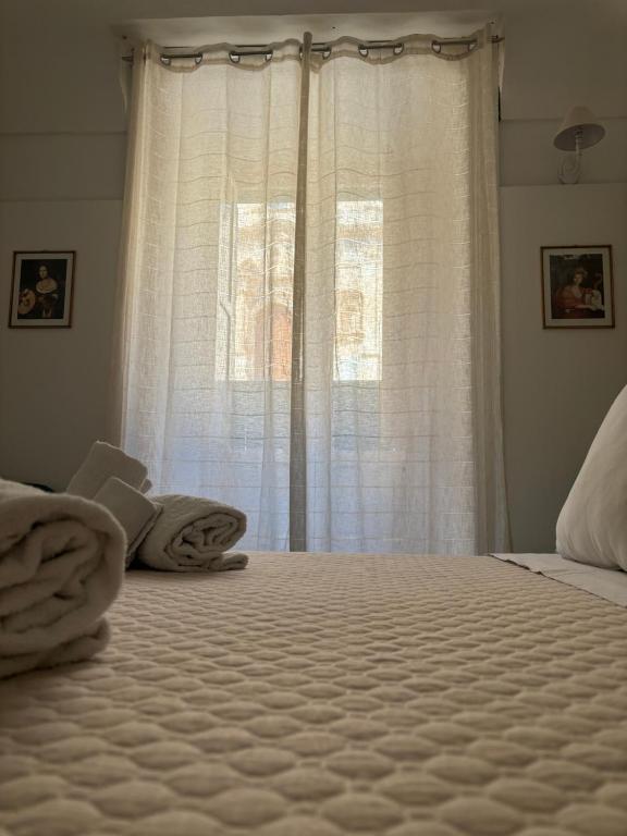 Postel nebo postele na pokoji v ubytování Immacolata Rooms