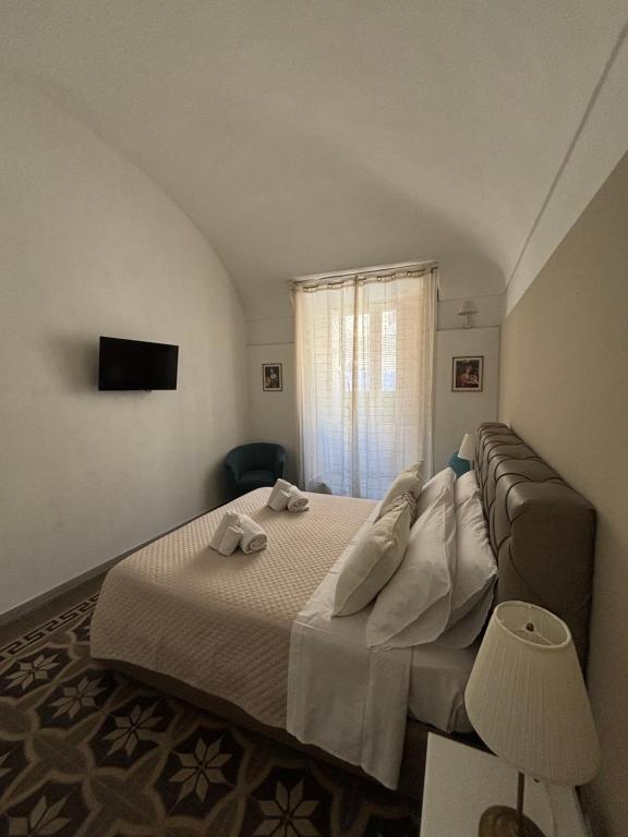 Postel nebo postele na pokoji v ubytování Immacolata Rooms