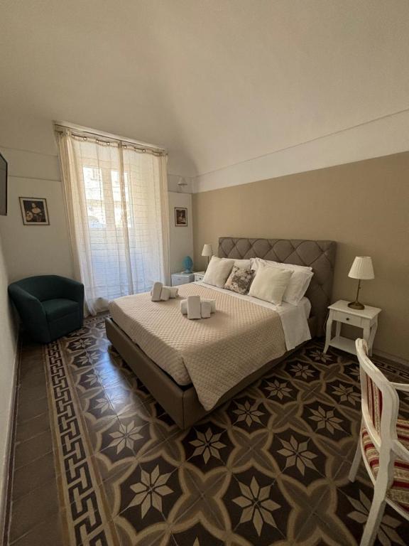 Postel nebo postele na pokoji v ubytování Immacolata Rooms
