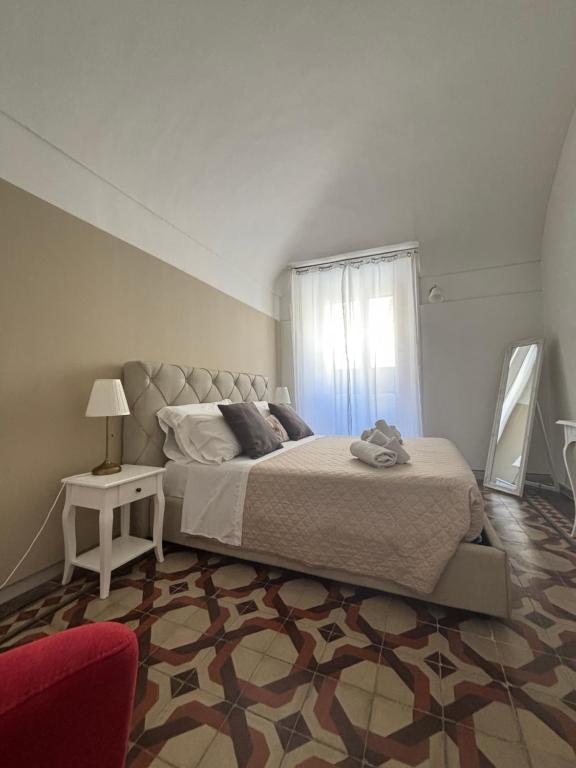Postel nebo postele na pokoji v ubytování Immacolata Rooms