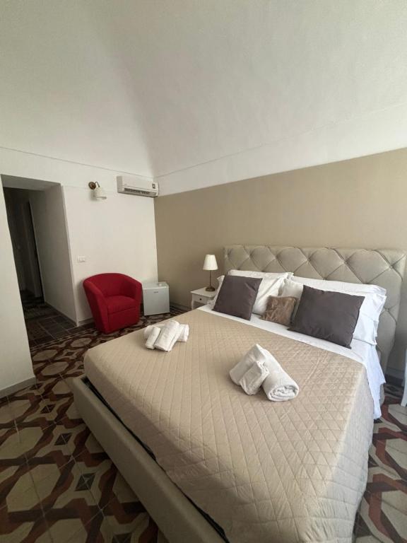 Postel nebo postele na pokoji v ubytování Immacolata Rooms