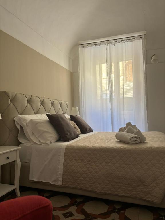 Postel nebo postele na pokoji v ubytování Immacolata Rooms