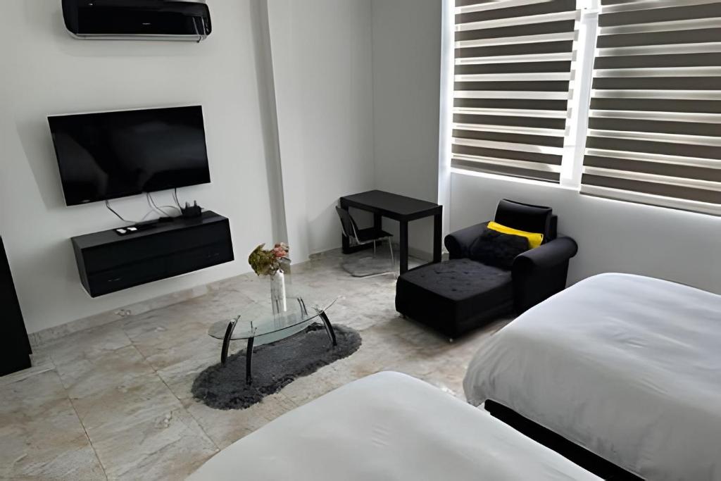 TV a/nebo společenská místnost v ubytování Rio-ApartaHotel-Centro