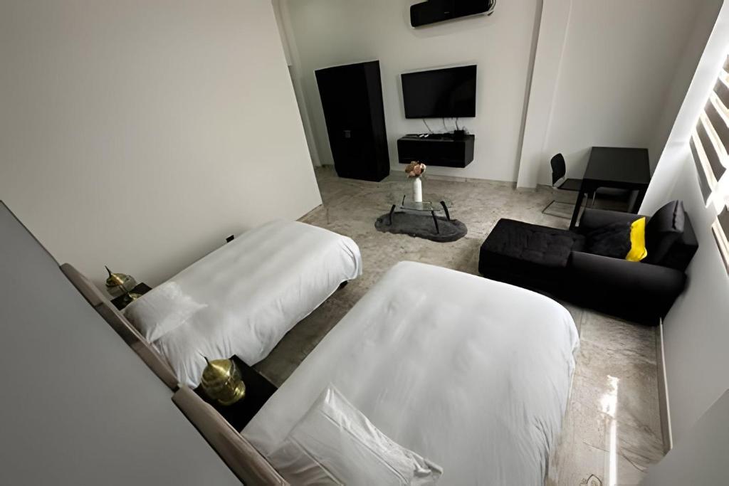 Postel nebo postele na pokoji v ubytování Rio-ApartaHotel-Centro