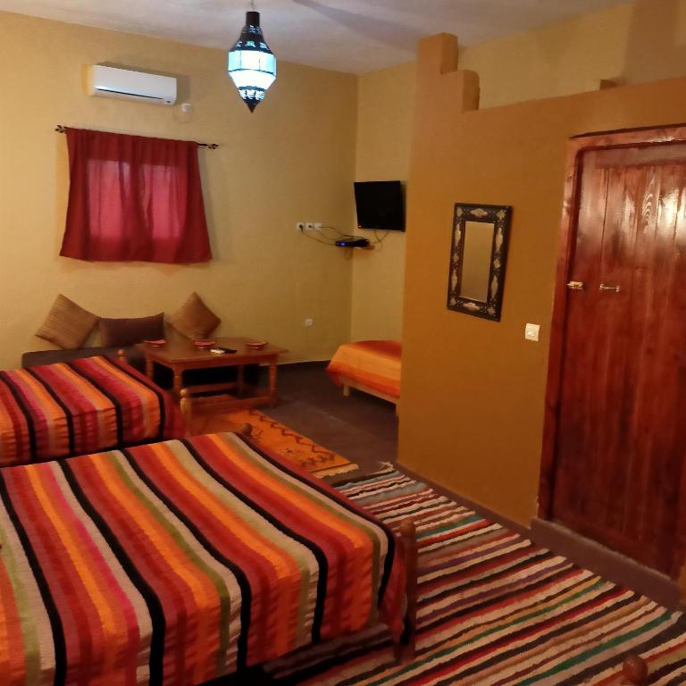 Postel nebo postele na pokoji v ubytování LESCALE DE OUARZAZATE