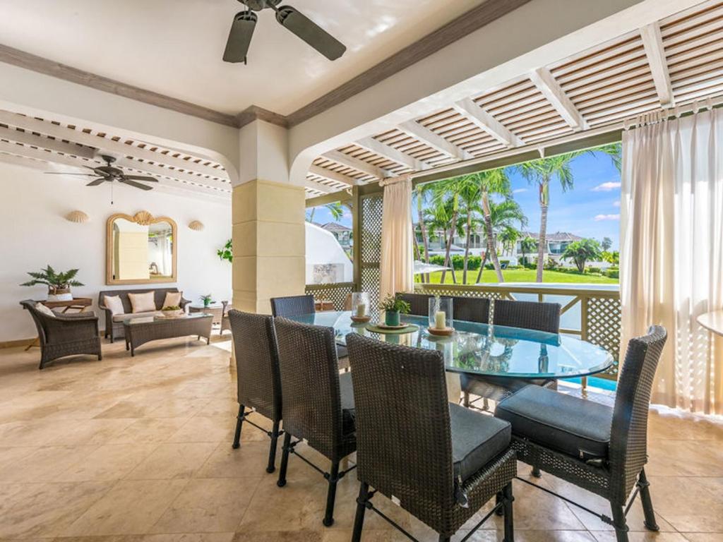 a dining room with a table and chairs at Tamarind Villa - Sugar Hill in Saint James