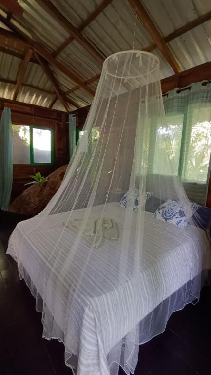 Postel nebo postele na pokoji v ubytování Playa Grande Lodge & Tree House