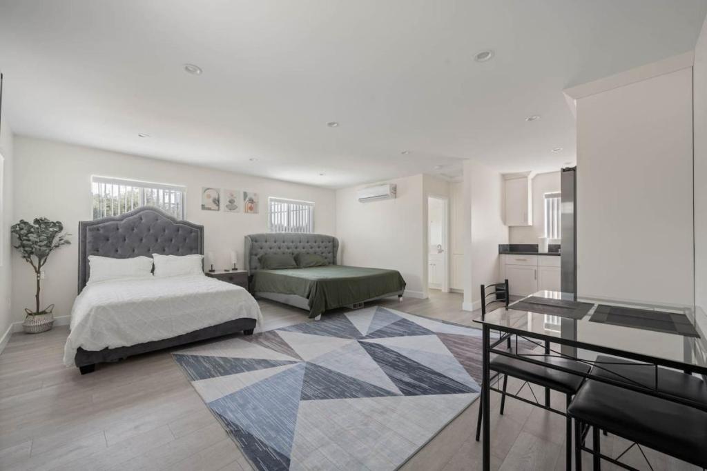 a bedroom with a bed and a table in it at Prime new beautiful studio in burbank in Burbank