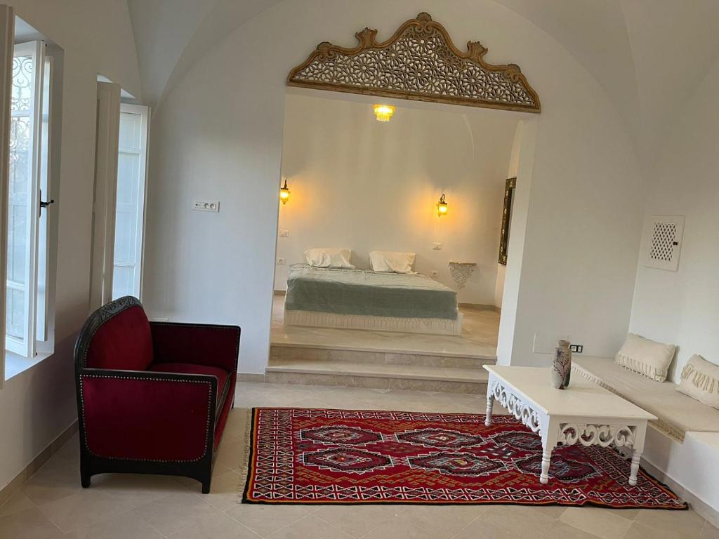 Rúm í herbergi á Dar Kalitoussa B&B Hammamet