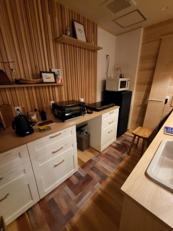 Kuchyň nebo kuchyňský kout v ubytování Rexline中辺路