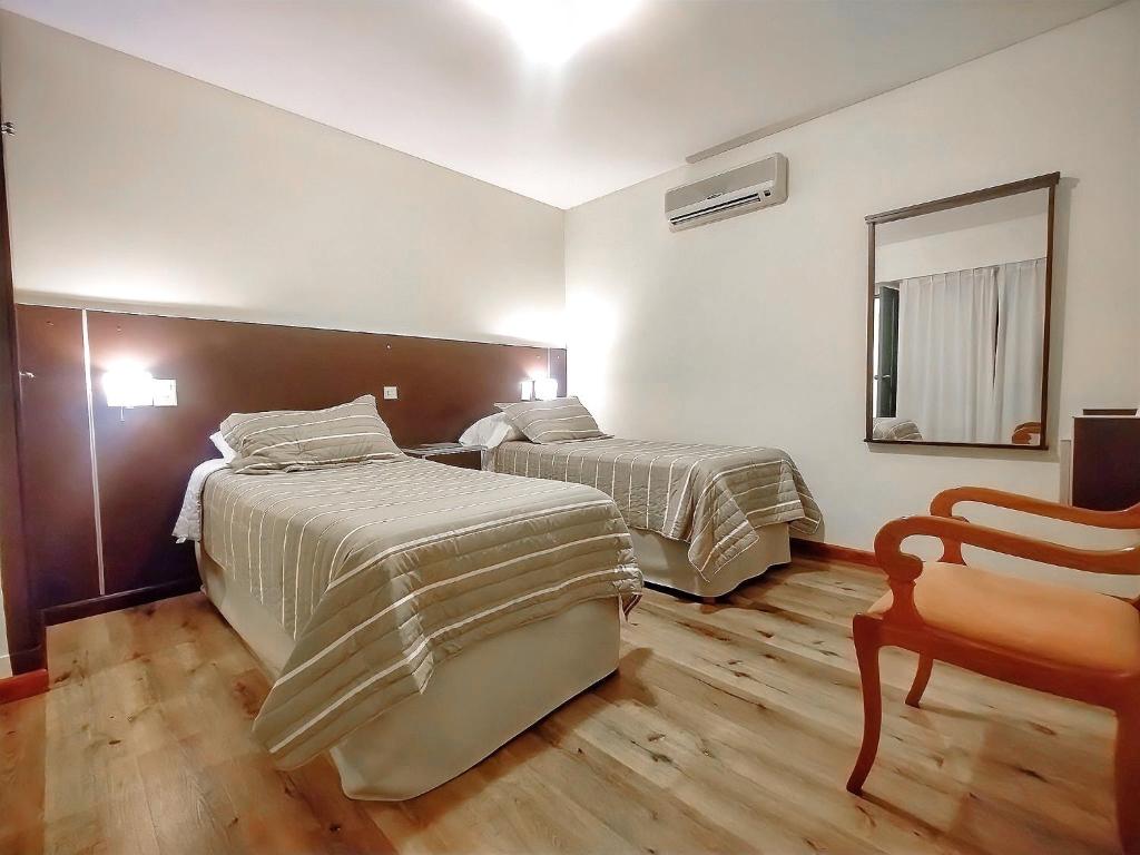 Cama ou camas em um quarto em Cóndor Suites Apart Hotel