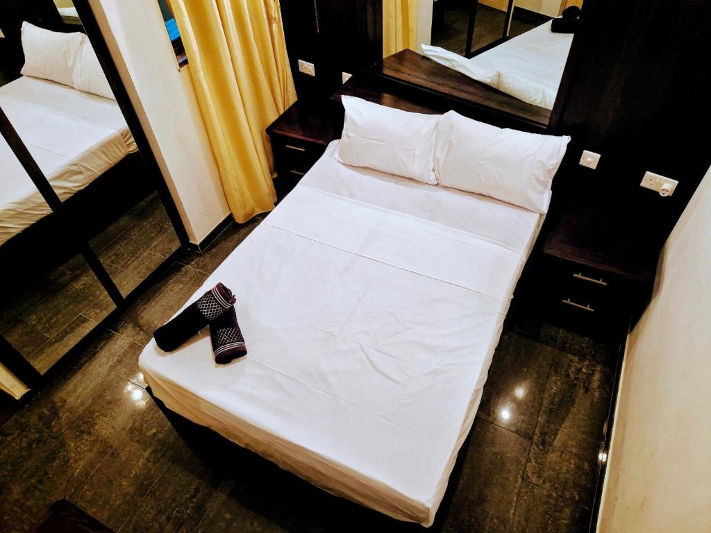 Uma cama ou camas num quarto em Barracuda
