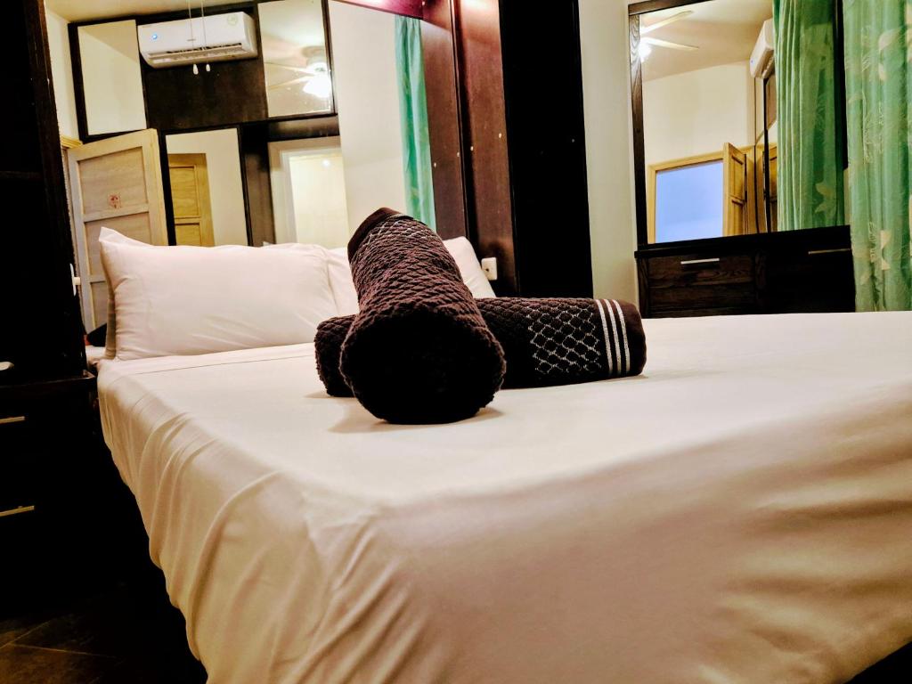 Uma cama ou camas num quarto em Barracuda
