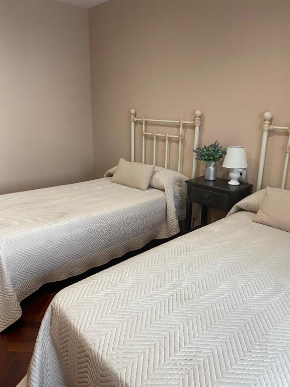 A bed or beds in a room at RECUNCHO DA LUZ