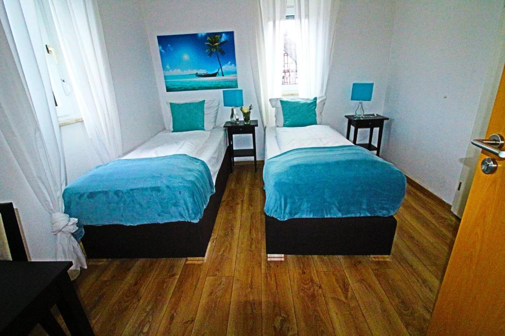 Postel nebo postele na pokoji v ubytování Apart Hotel Paradies