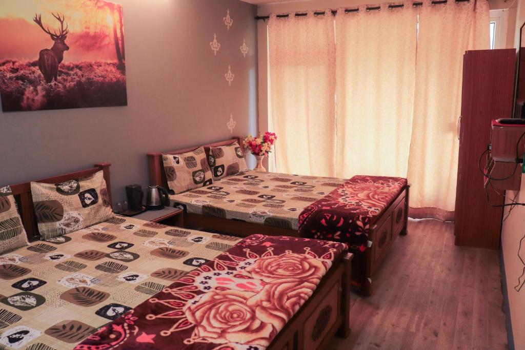 Postel nebo postele na pokoji v ubytování Themapleview