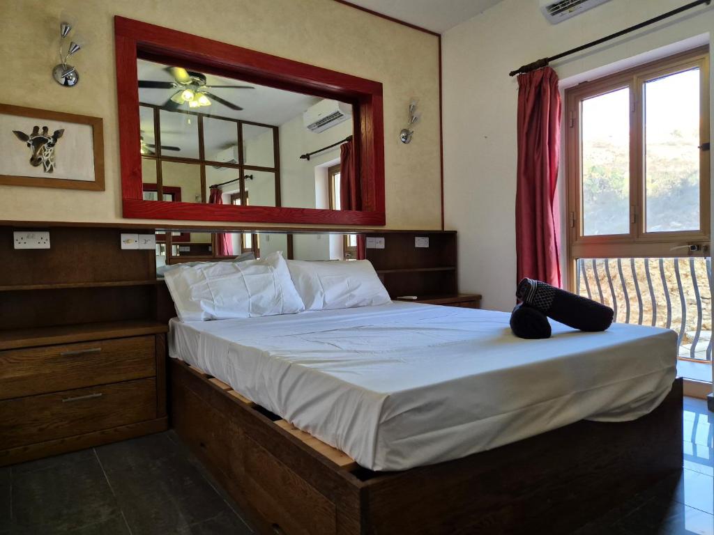 Uma cama ou camas num quarto em Barracuda
