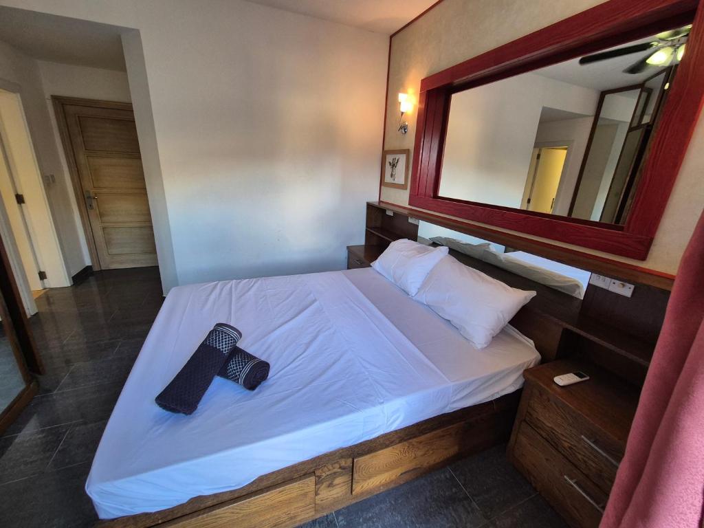 Uma cama ou camas num quarto em Barracuda