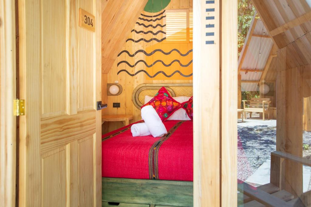 Ein Bett oder Betten in einem Zimmer der Unterkunft Socialtel Atitlan
