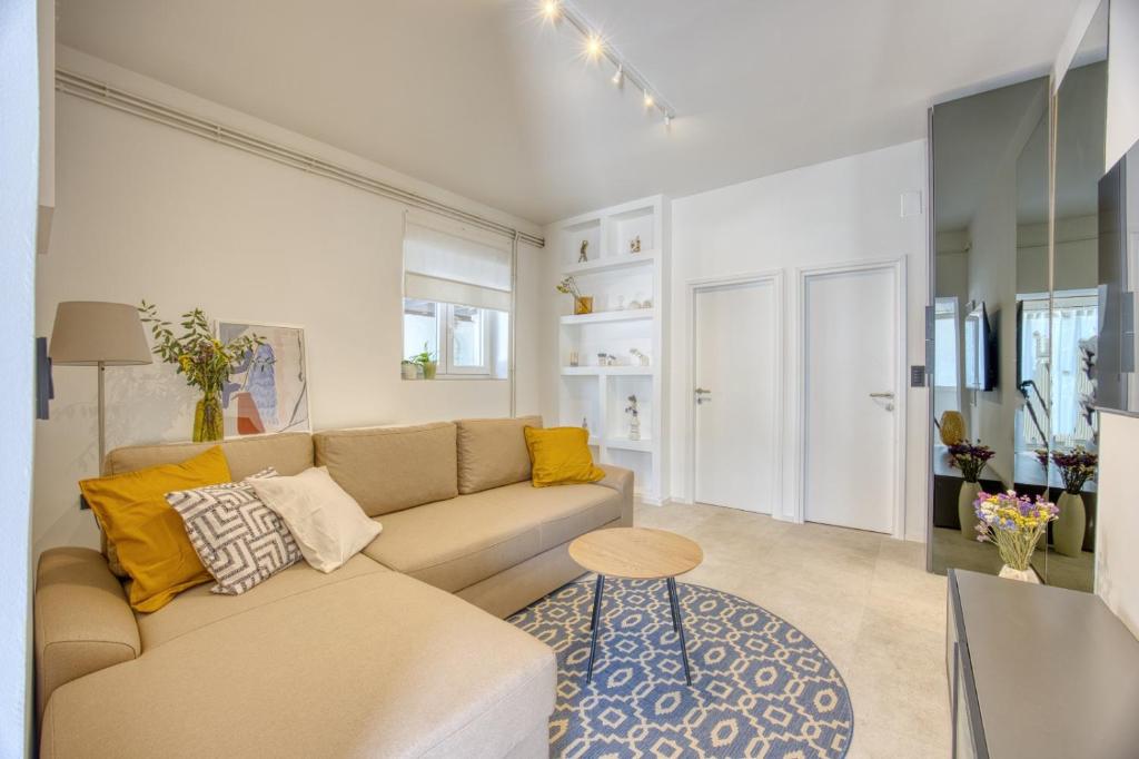 a living room with a couch and a table at Apartman Ivan in Posedarje