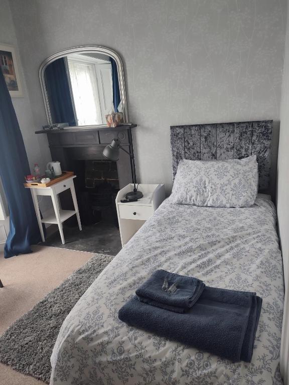 Postel nebo postele na pokoji v ubytování Garryhack House