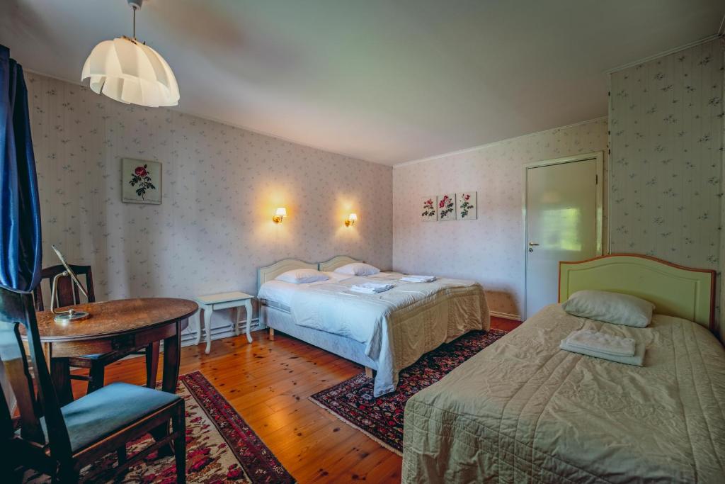 Säng eller sängar i ett rum på Svaneholm Hotel