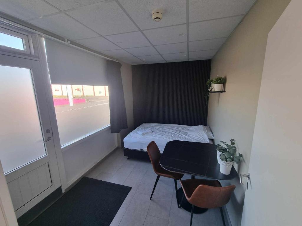 Postel nebo postele na pokoji v ubytování Við Hafið Guesthouse
