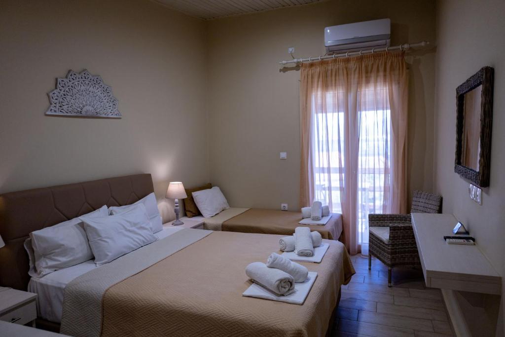 Postel nebo postele na pokoji v ubytování Venus Beach Hotel