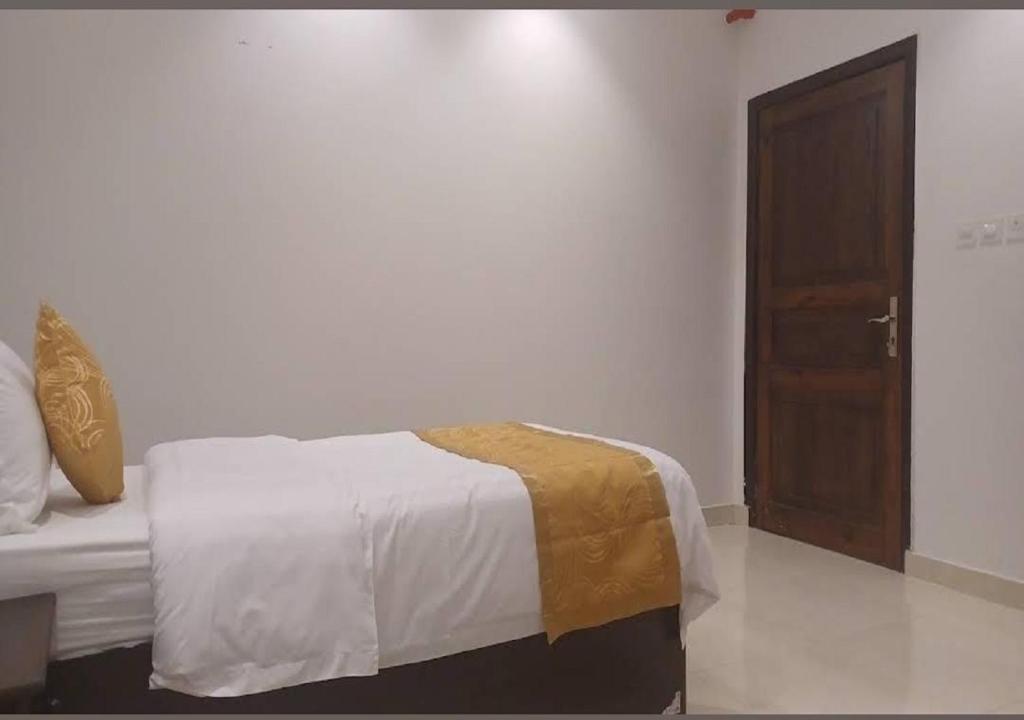 Postel nebo postele na pokoji v ubytování السارية