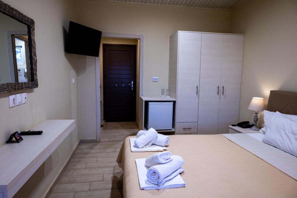 Postel nebo postele na pokoji v ubytování Venus Beach Hotel