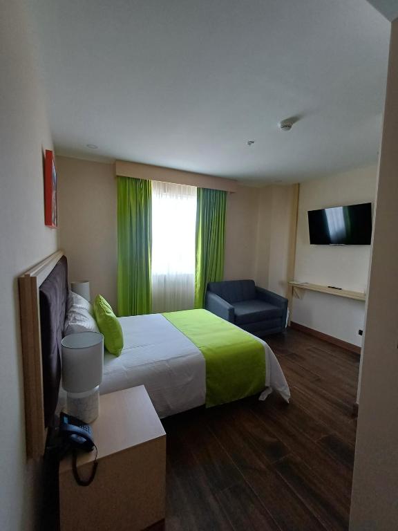 Postel nebo postele na pokoji v ubytování Hotel Puerto Limón CR