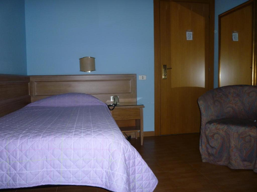 Posteľ alebo postele v izbe v ubytovaní Hotel Ascot