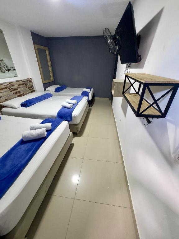 Postel nebo postele na pokoji v ubytování Hotel Select Medellin