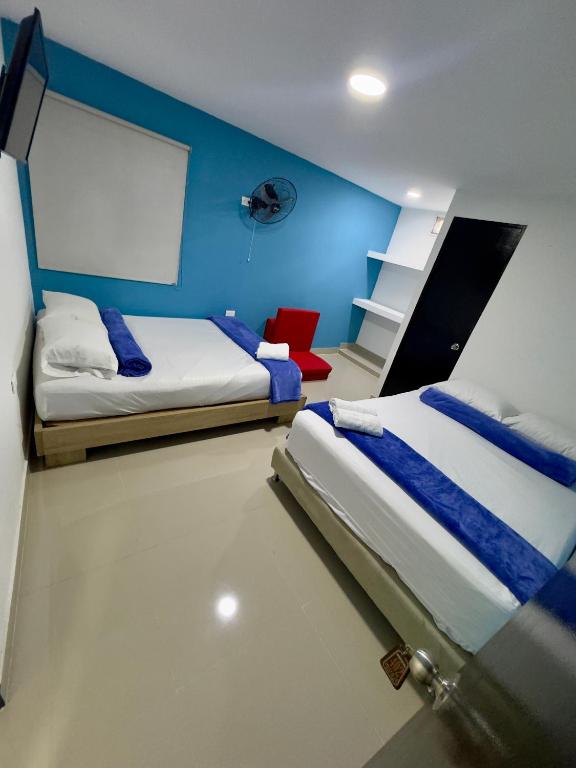 Postel nebo postele na pokoji v ubytování Hotel Select Medellin