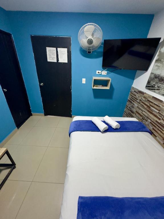 Postel nebo postele na pokoji v ubytování Hotel Select Medellin