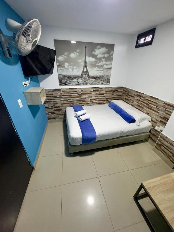 Postel nebo postele na pokoji v ubytování Hotel Select Medellin