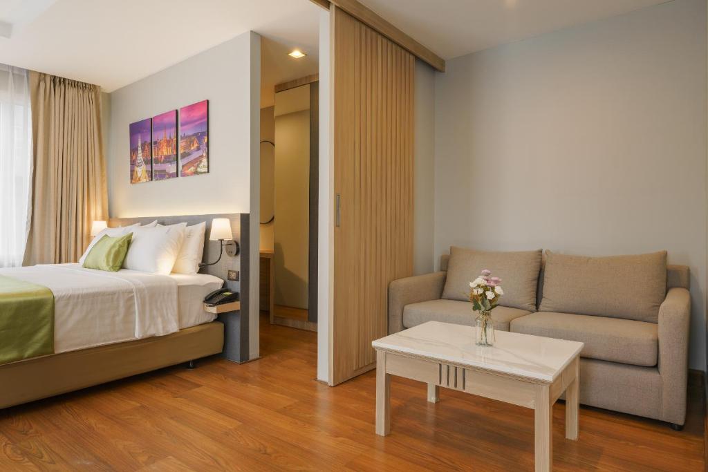 Postel nebo postele na pokoji v ubytování iCheck inn Residence soi 2