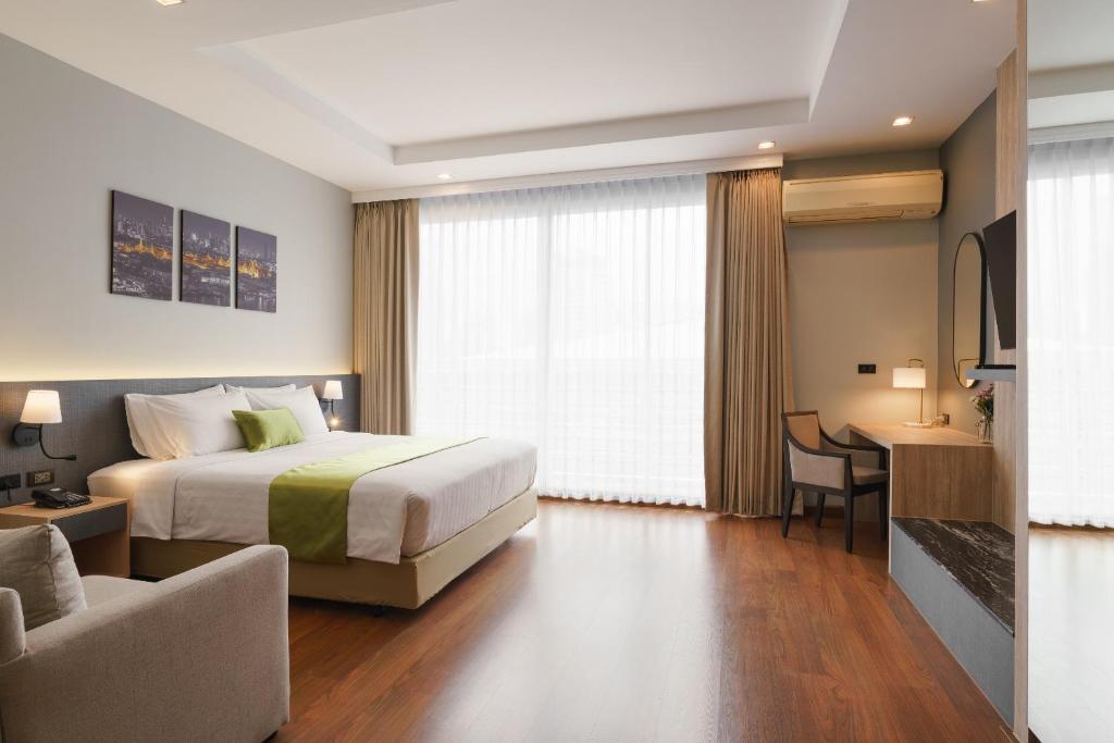 Postel nebo postele na pokoji v ubytování iCheck inn Residence soi 2