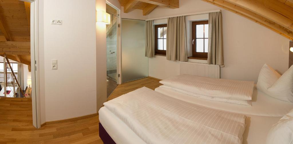 Postel nebo postele na pokoji v ubytování Aigenberg Appartements