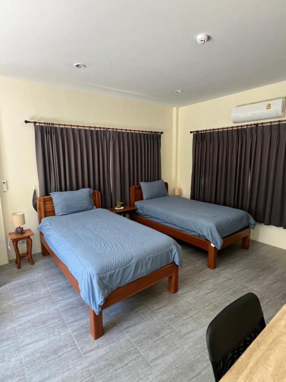 Postel nebo postele na pokoji v ubytování BSK Bungalows