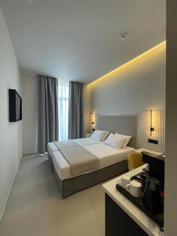 Posteľ alebo postele v izbe v ubytovaní Palladion Boutique Hotel