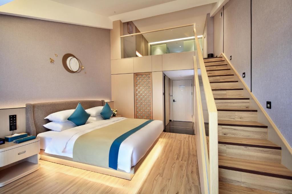 Postel nebo postele na pokoji v ubytování 桂林桂花树下酒店 Guilin Osmanthus Tree Resort
