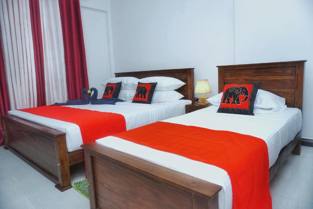 Postel nebo postele na pokoji v ubytování Sashini Homestay