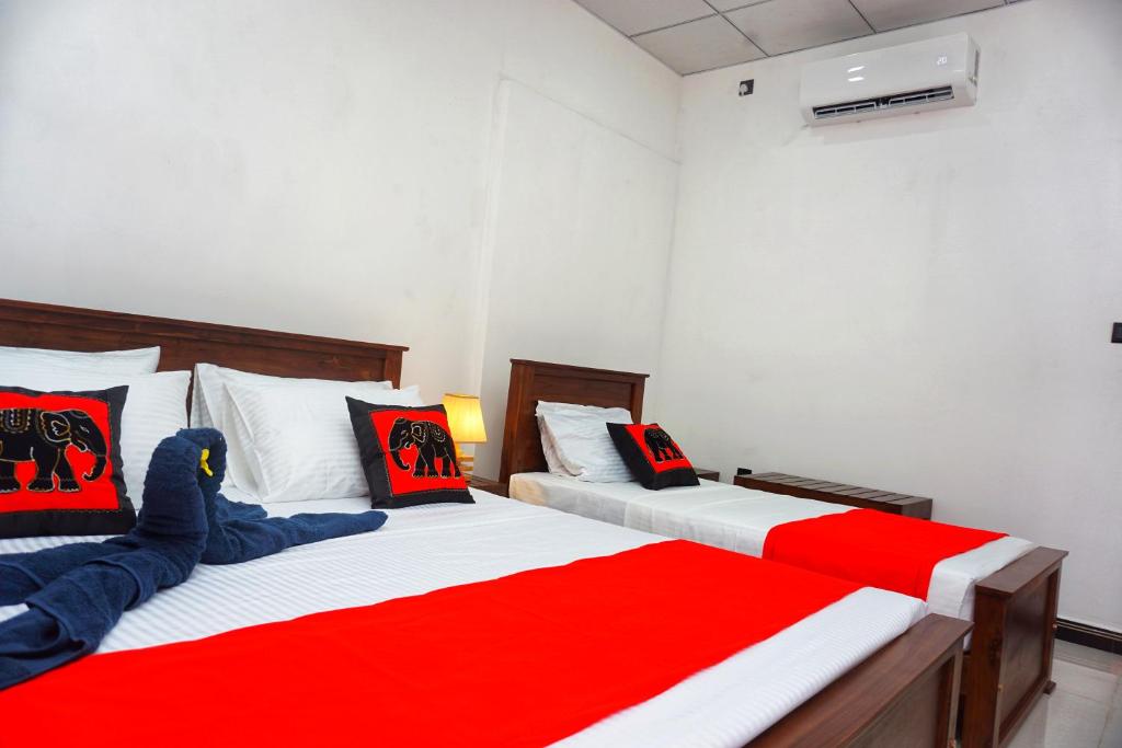 Postel nebo postele na pokoji v ubytování Sashini Homestay